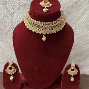 Gold plated polki Kundan necklace with mang tikka and earrings